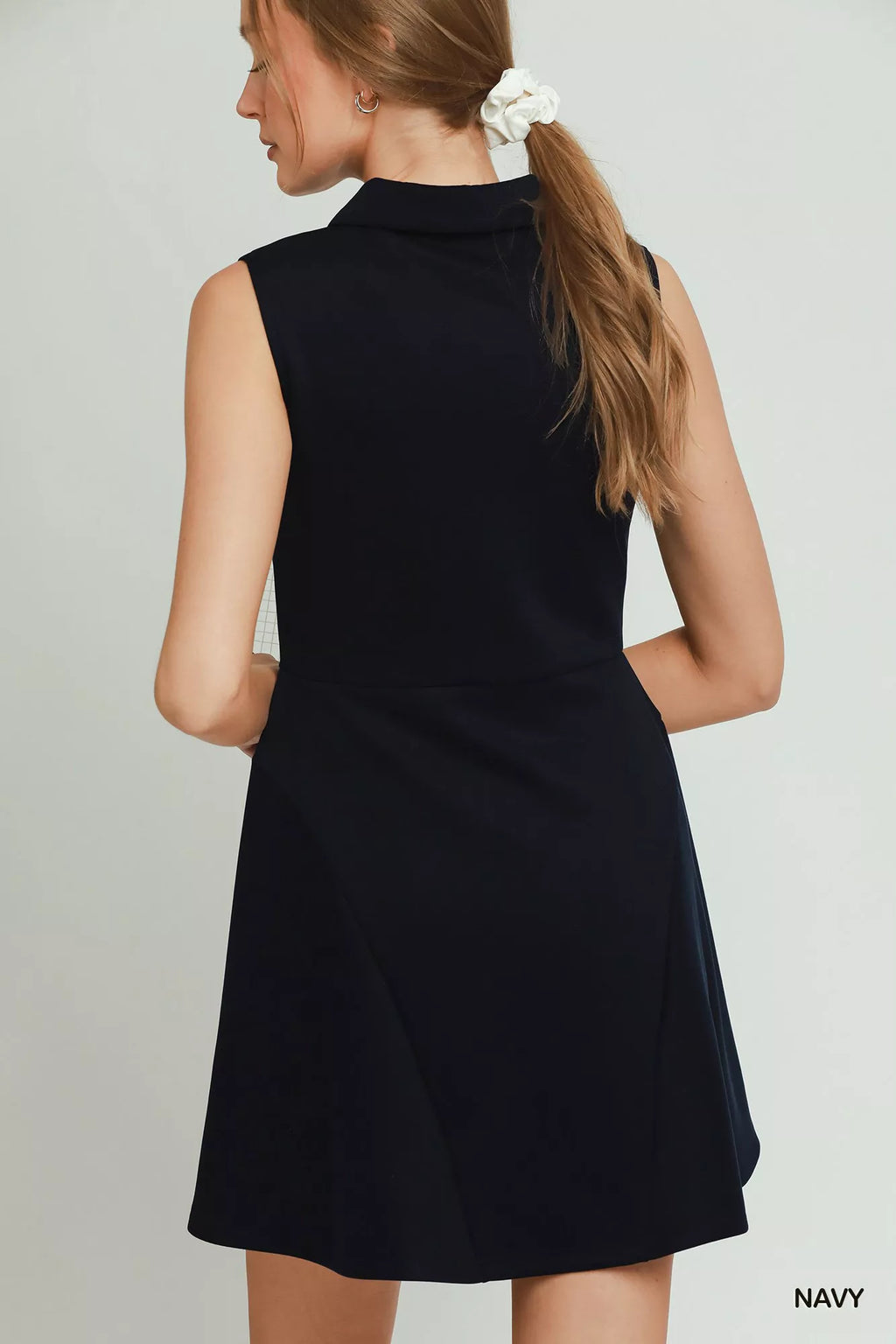 Umgee collared quarter zip tennis dress by Trendsi, featuring a sporty collar, quarter zip front, and comfortable dress style.