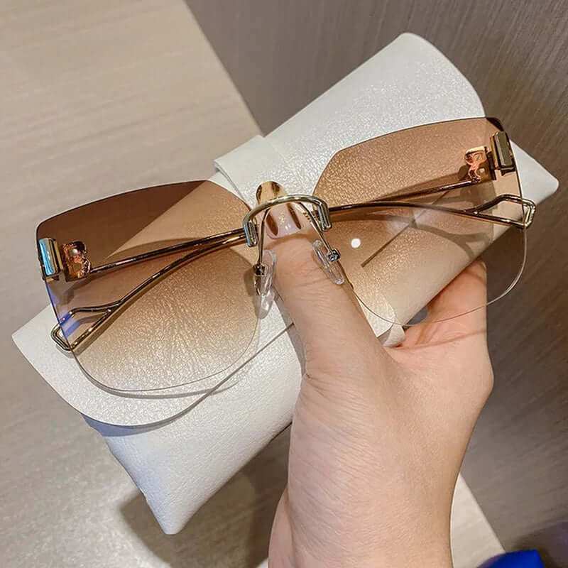 Vintage Brand Designer Sunglasses Fashion Oversized Rimless SunglassesElevate your style with our Vintage Brand Designer Sunglasses. Made with high-quality materials, these oversized rimless sunglasses offer 99% UV protection and 1.3 mSunglassesPlush Fashions ShopPlush Fashion Shop