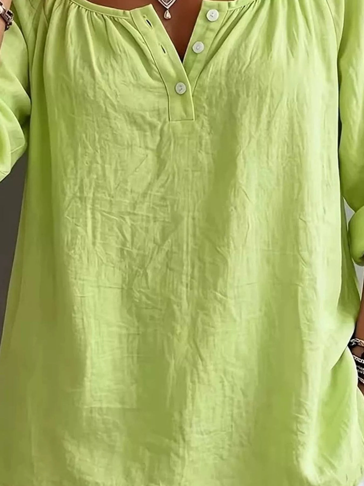 Plush Fashion Hub long sleeve top with button details, soft fabric, and a stylish fit, shown on a model against a neutral background.