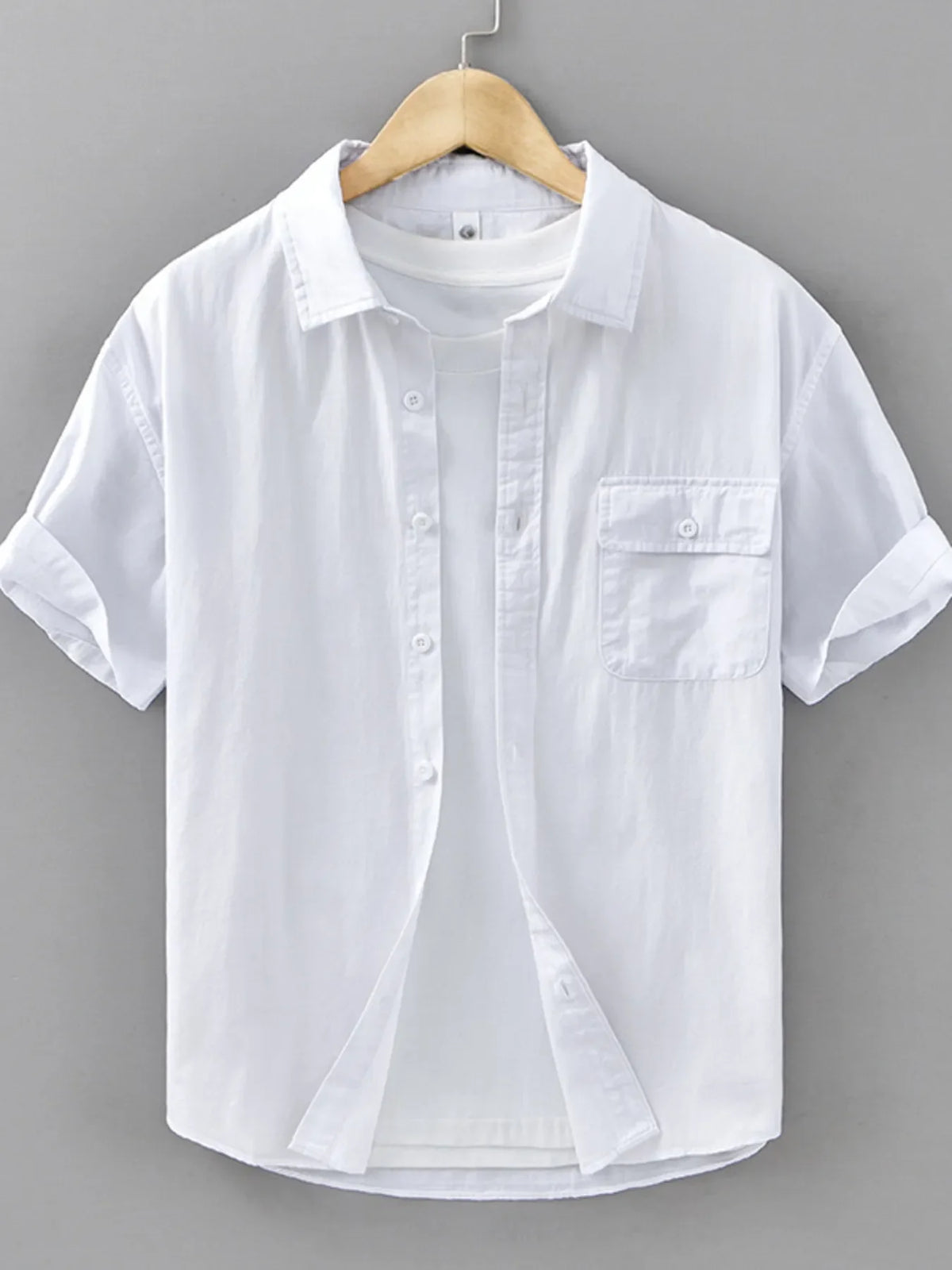 Men's plus size short sleeve button-up shirt by Plush Fashion Hub, featuring a casual design and comfortable fit.