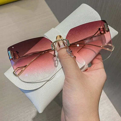 Vintage Brand Designer Sunglasses Fashion Oversized Rimless SunglassesElevate your style with our Vintage Brand Designer Sunglasses. Made with high-quality materials, these oversized rimless sunglasses offer 99% UV protection and 1.3 mSunglassesPlush Fashions ShopPlush Fashion Shop