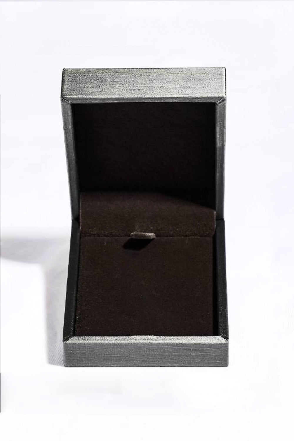 Platinum plated key pendant necklace with 1-carat moissanite gemstone, elegant jewelry piece with intricate design details.