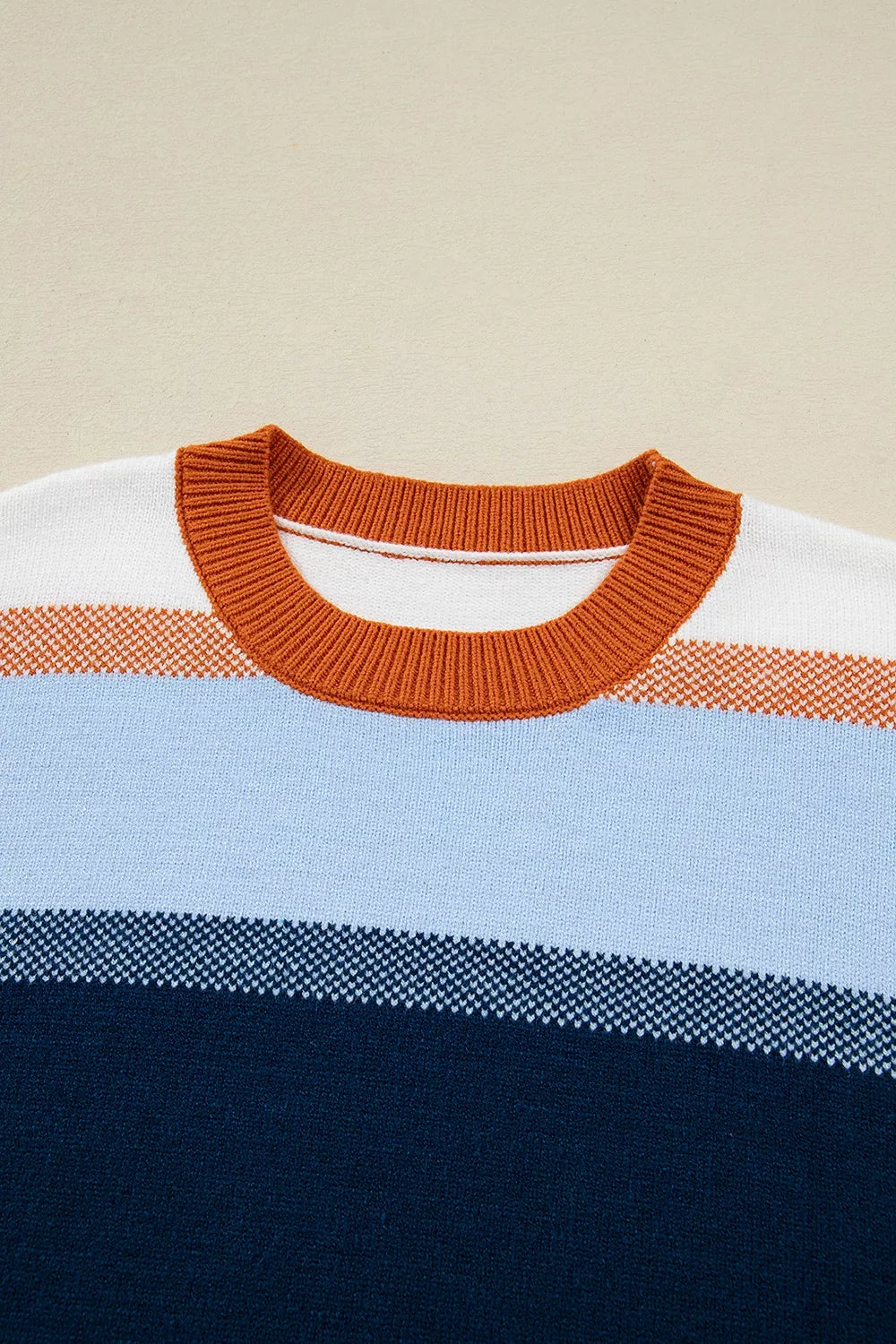 Color block round neck tunic sweater from Trendsi, featuring a cozy knit design in vibrant color blocks and a classic round neckline.