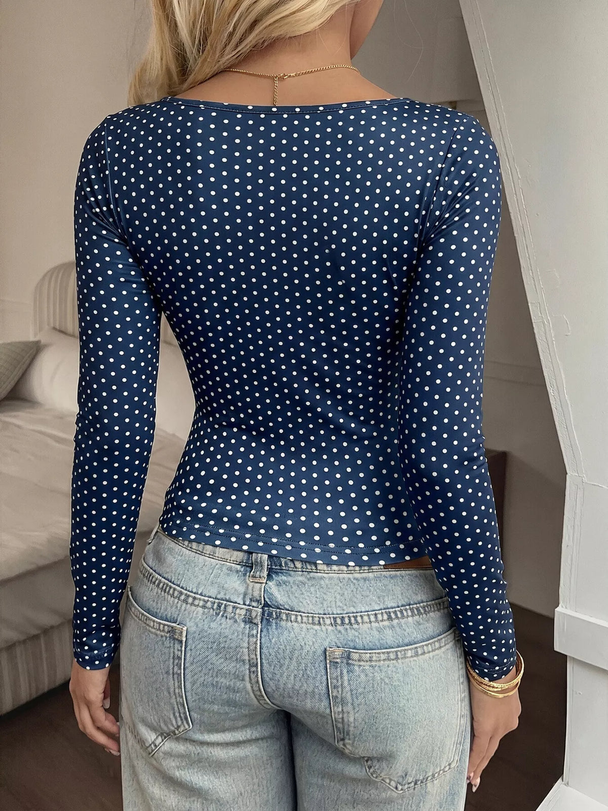 Women’s polka dot square neck long sleeve T-shirt from Trendsi, featuring a stylish design and comfortable fit.