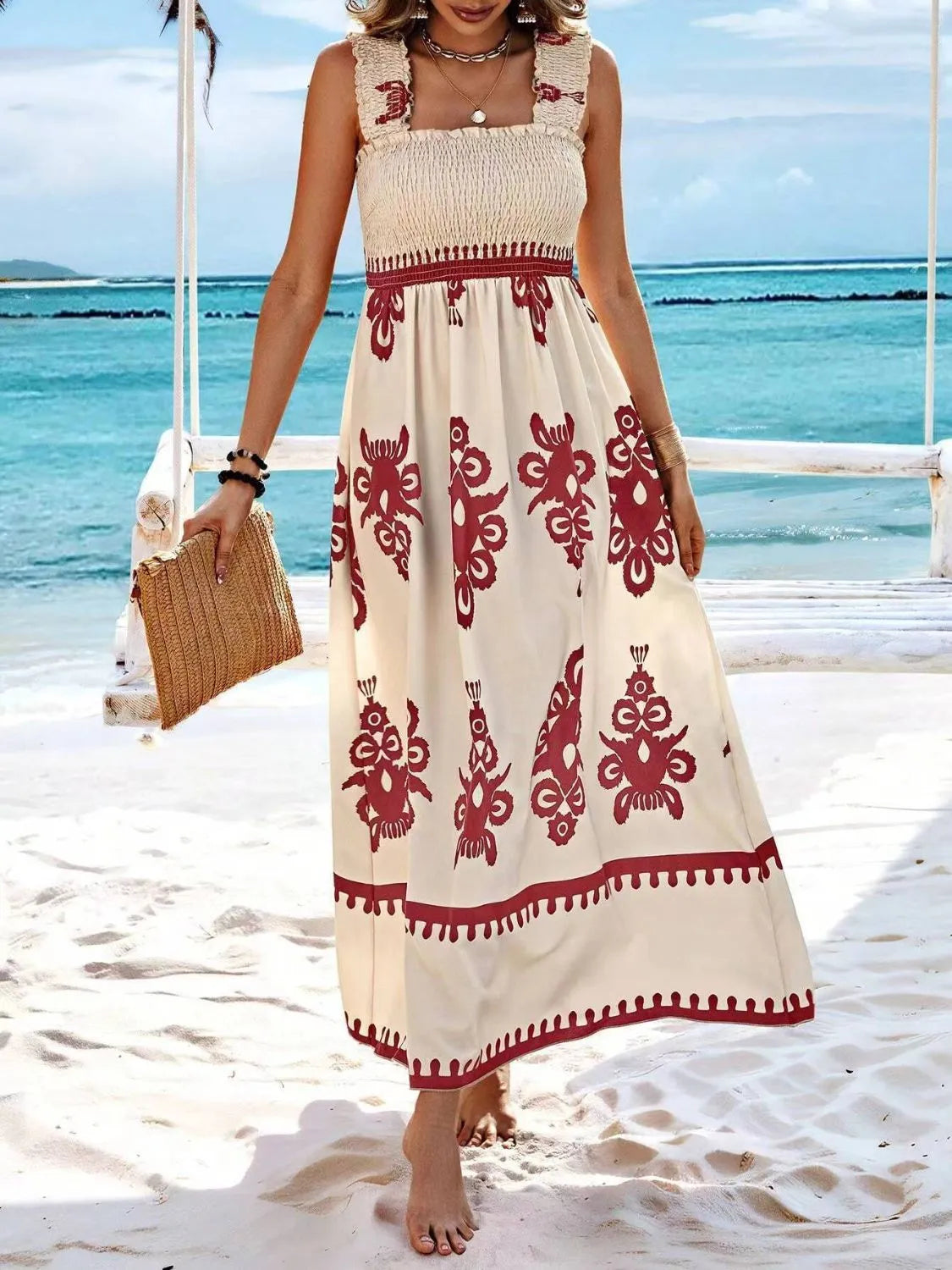 Plush Fashion Hub smocked printed wide strap maxi dress featuring a flowing silhouette and colorful floral pattern.