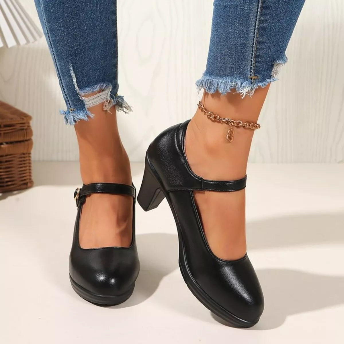 Black buckle block heels pumps from Trendsi featuring a stylish chunky heel and ankle strap for a fashionable look.