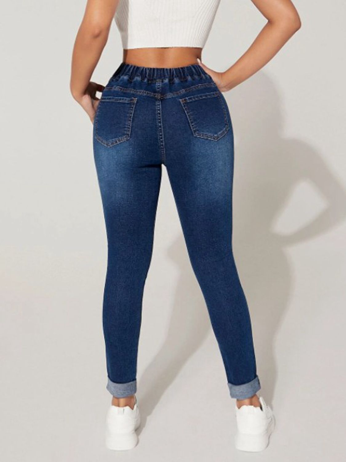 Plush Fashion Hub cropped denim jeans with drawstring waist and classic blue wash, shown on a model.