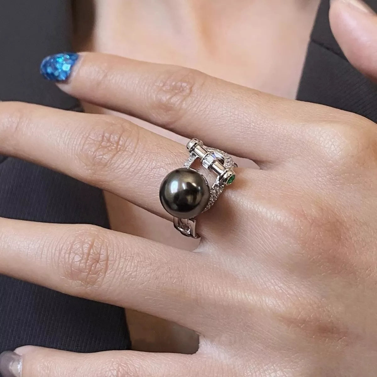 Sterling silver zircon pearl ring featuring a lustrous pearl and sparkling zircon stones, designed for elegant jewelry wear.