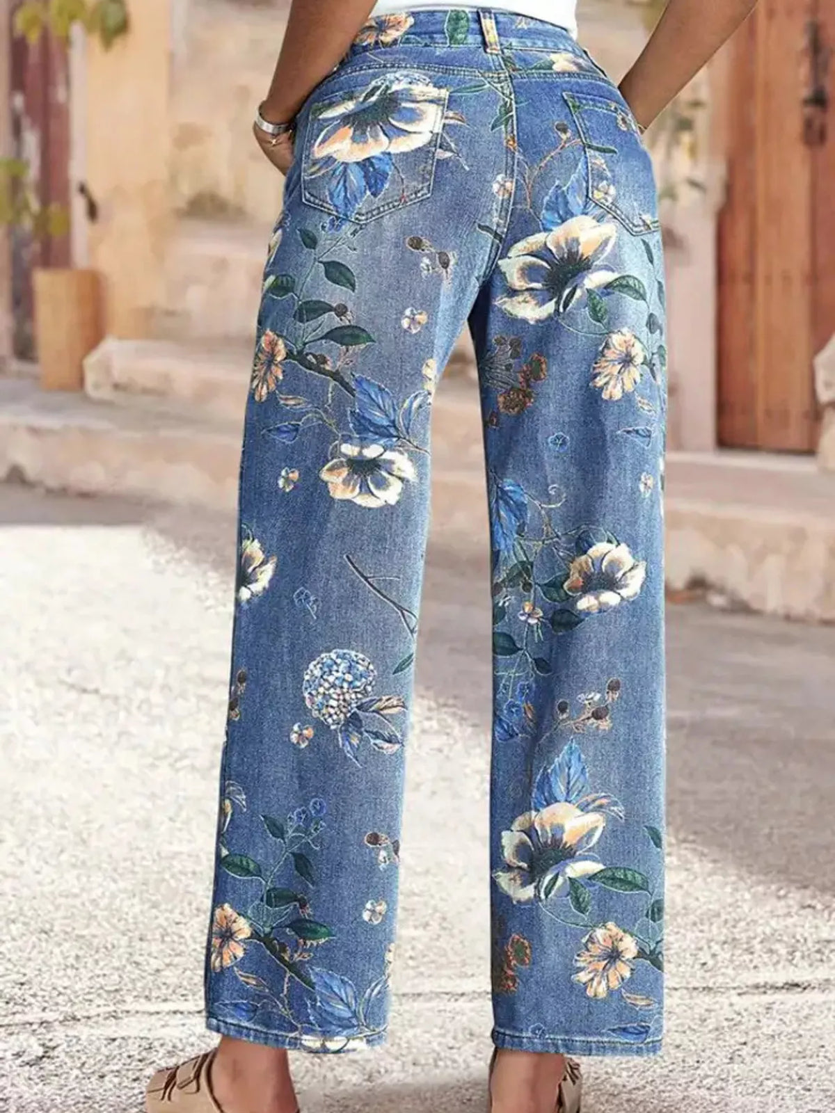 Floral print wide-leg jeans from Plush Fashion Hub featuring a stylish, flowing design and vibrant floral pattern.
