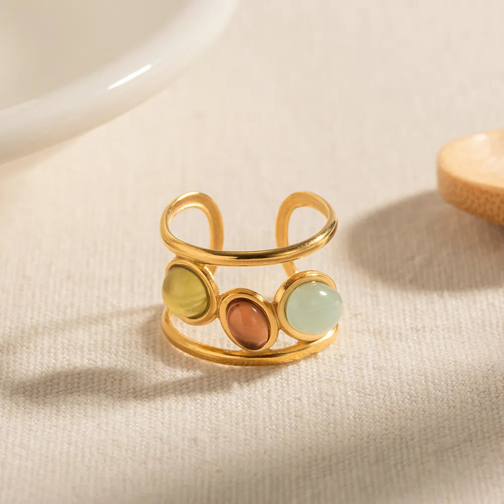 18K gold plated gemstone open cuff ring with intricate design, featuring colorful gemstones and a stylish, modern look.