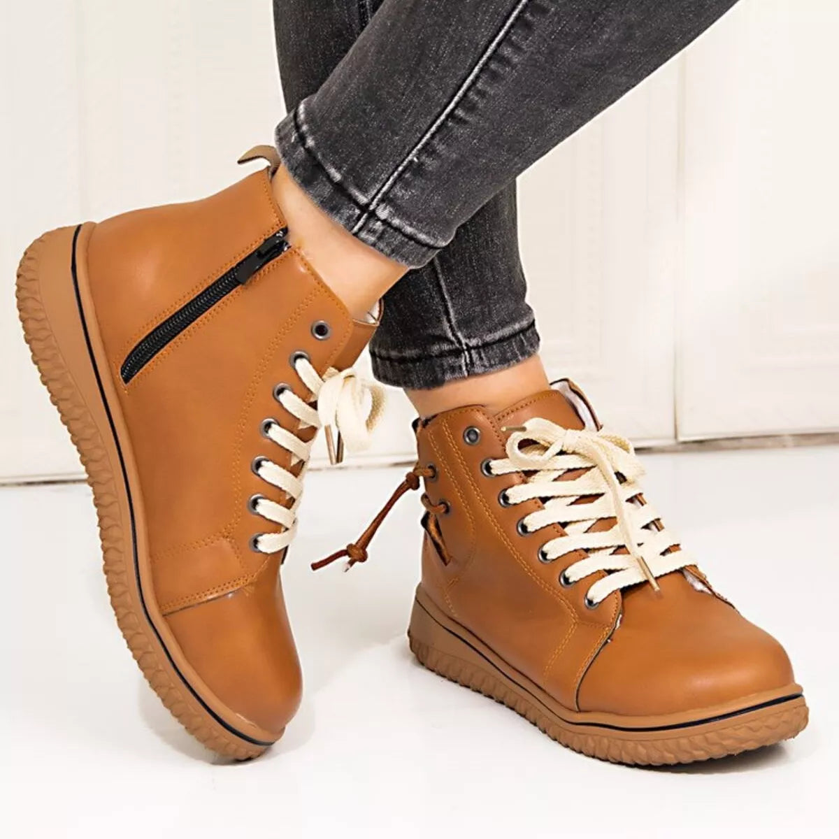 Women's round toe platform ankle boots by Trendsi featuring a stylish design and chunky heel, ideal for casual or trendy outfits.