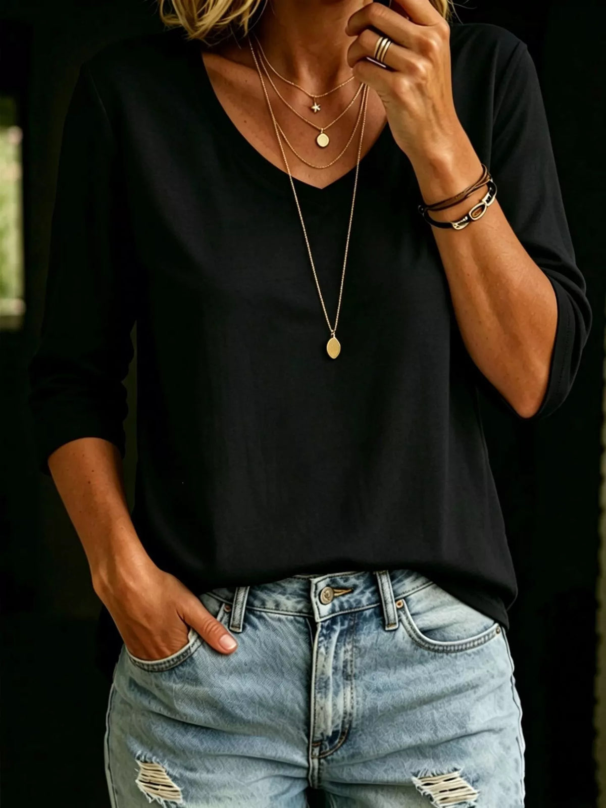 Plus size V-neck T-shirt with 3/4 sleeves, full-size fit, from Trendsi, shown in a comfortable, casual top style.