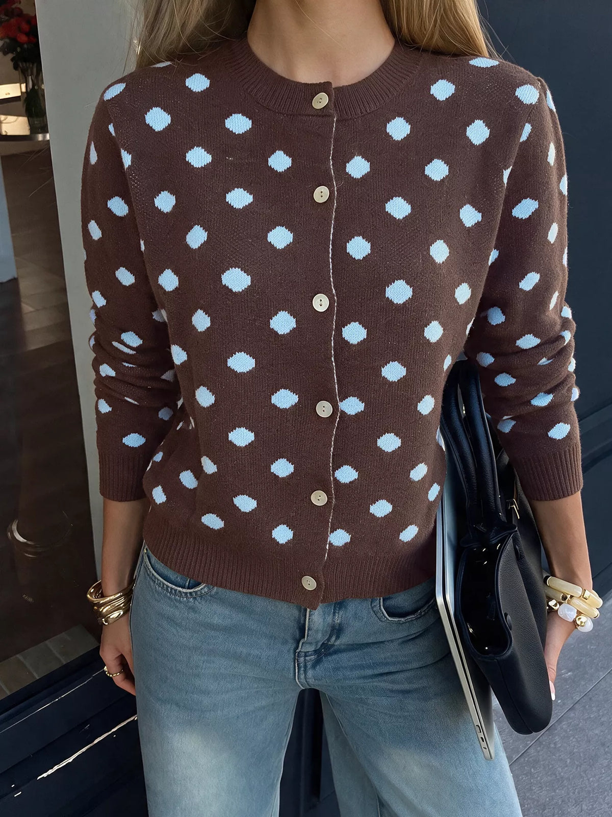 Women’s polka dot button-up cardigan by Trendsi, featuring a cozy knit fabric, classic pattern, and front button closure.