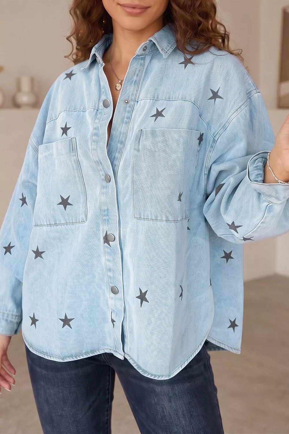Light wash denim jacket for women with star print, trendy casual jacket from Trendsi featuring button closure and stylish design.