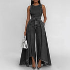 Women’s sleeveless wide-leg denim jumpsuit by FitiqueFit featuring a crew neck and casual style, shown on a model.