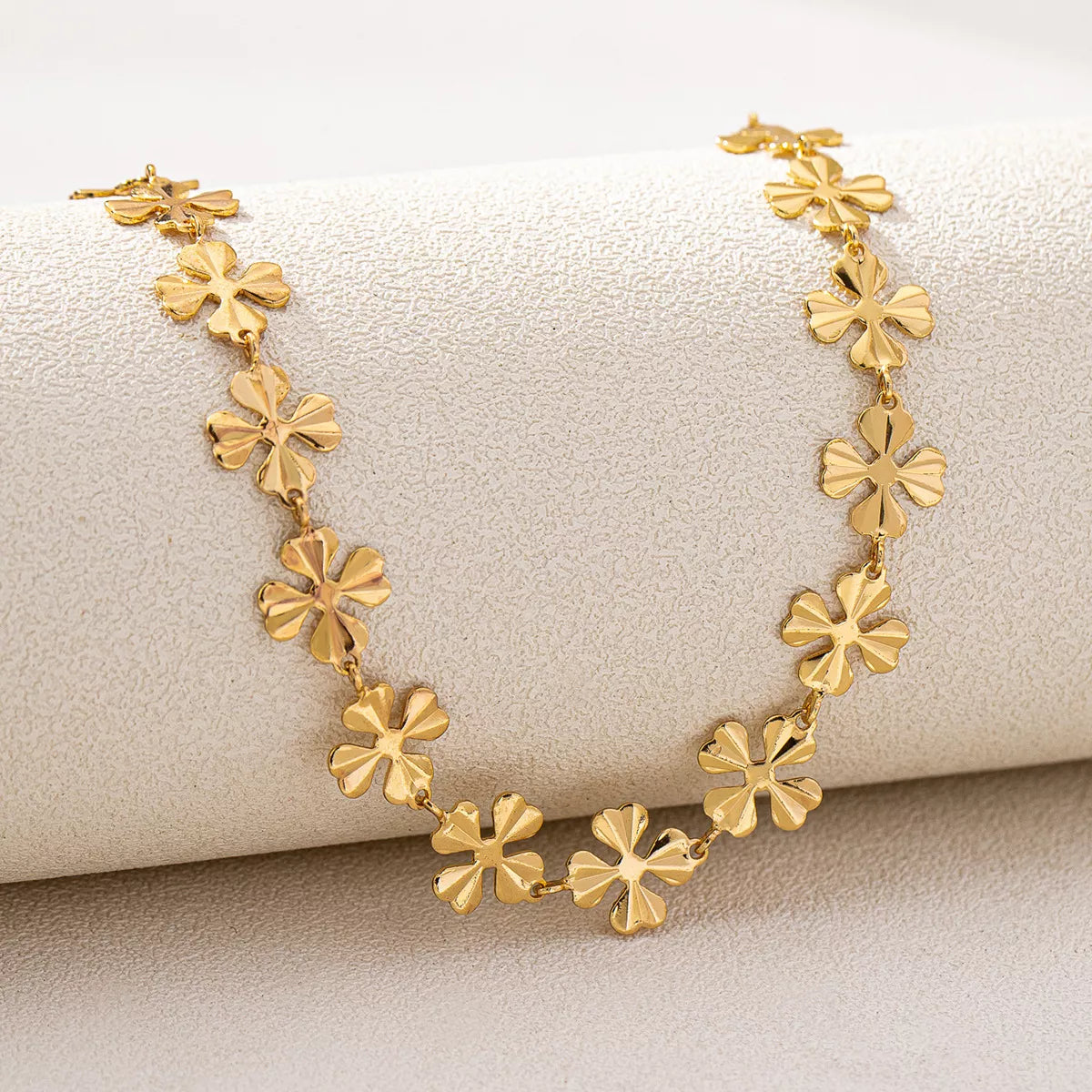 18K gold-plated alloy flower chain necklace with delicate floral design, crafted by Plush Fashion Hub.