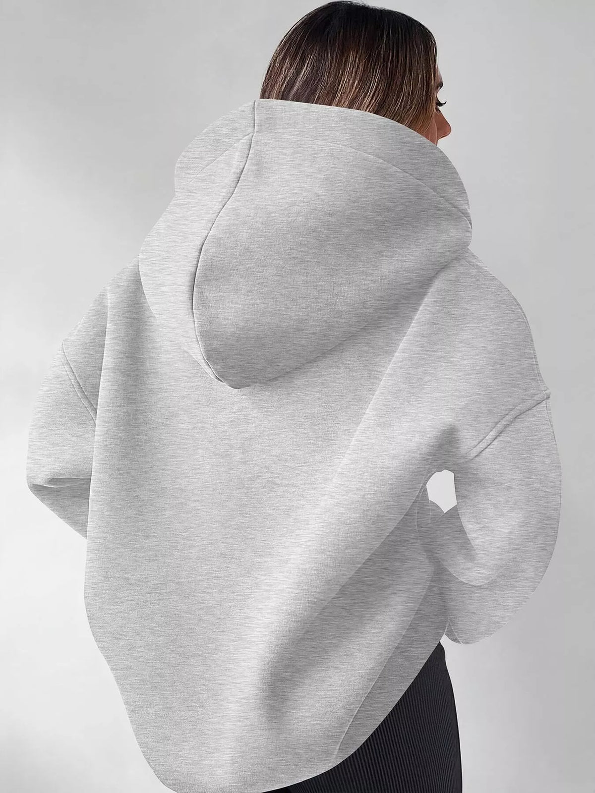 Oversized quarter-zip hoodie from Trendsi, featuring a relaxed fit and soft fabric, perfect for casual wear and layering.