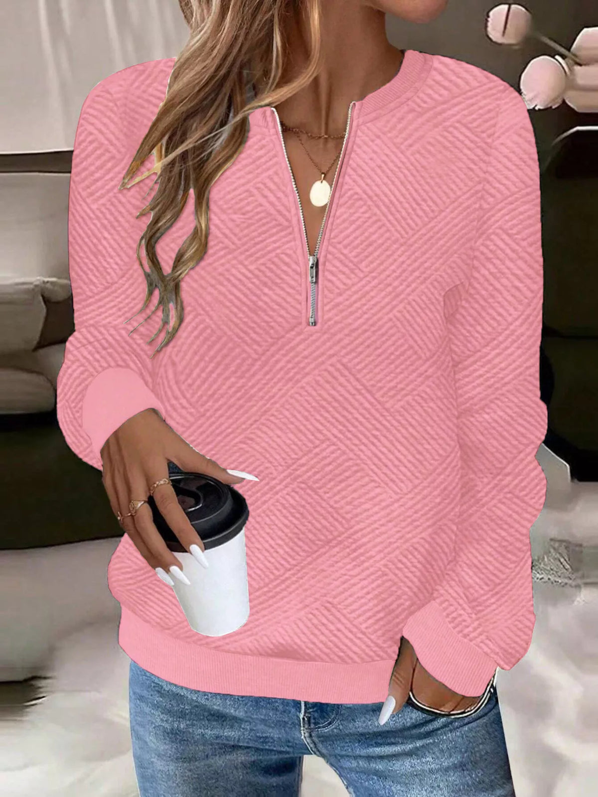 Textured women's quarter-zip sweatshirt by Trendsi featuring a cozy, stylish design with a high collar and long sleeves.