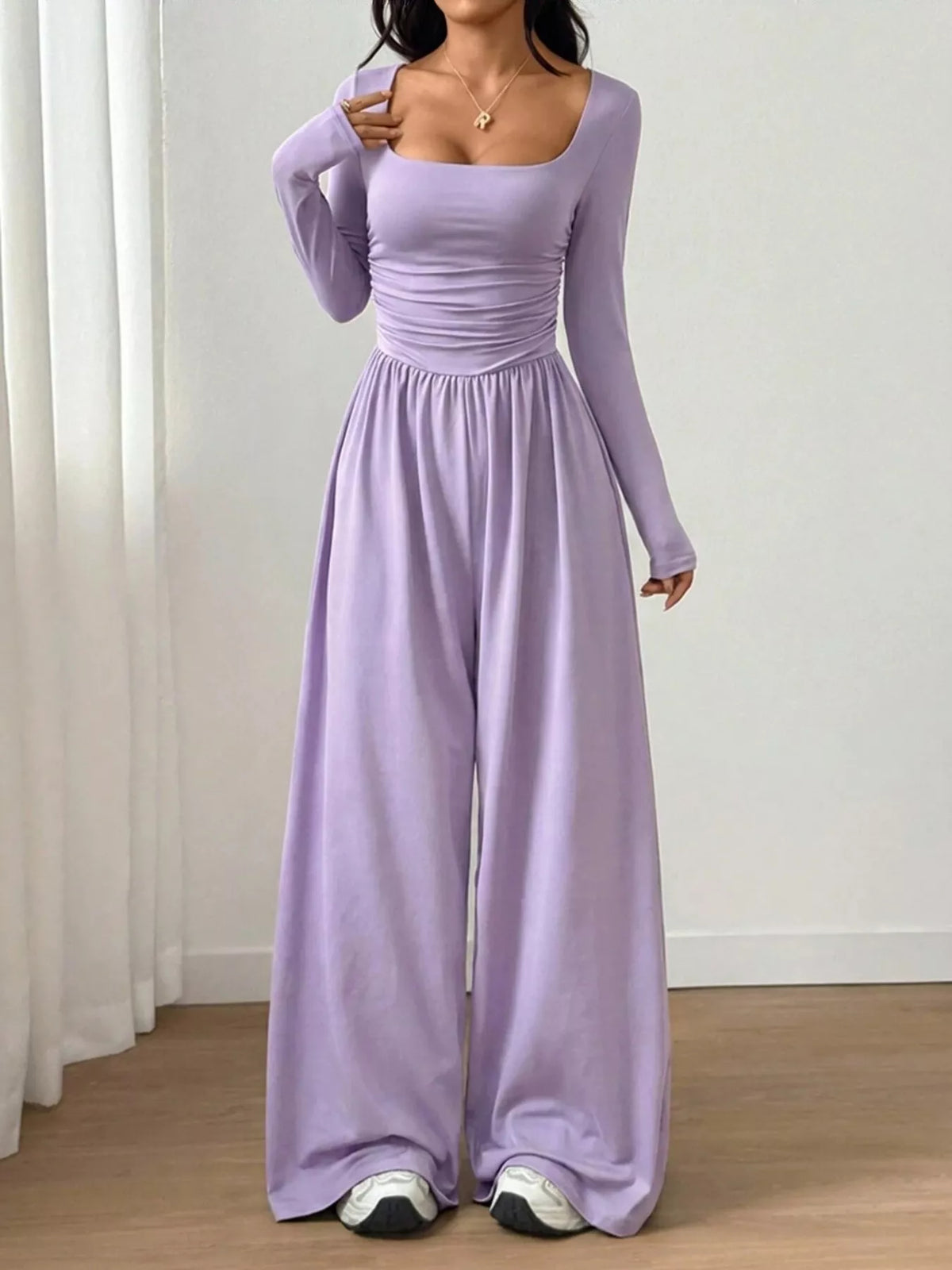 Ruched square neck wide-leg jumpsuit by Trendsi featuring a stylish design and flattering fit, shown in the image.