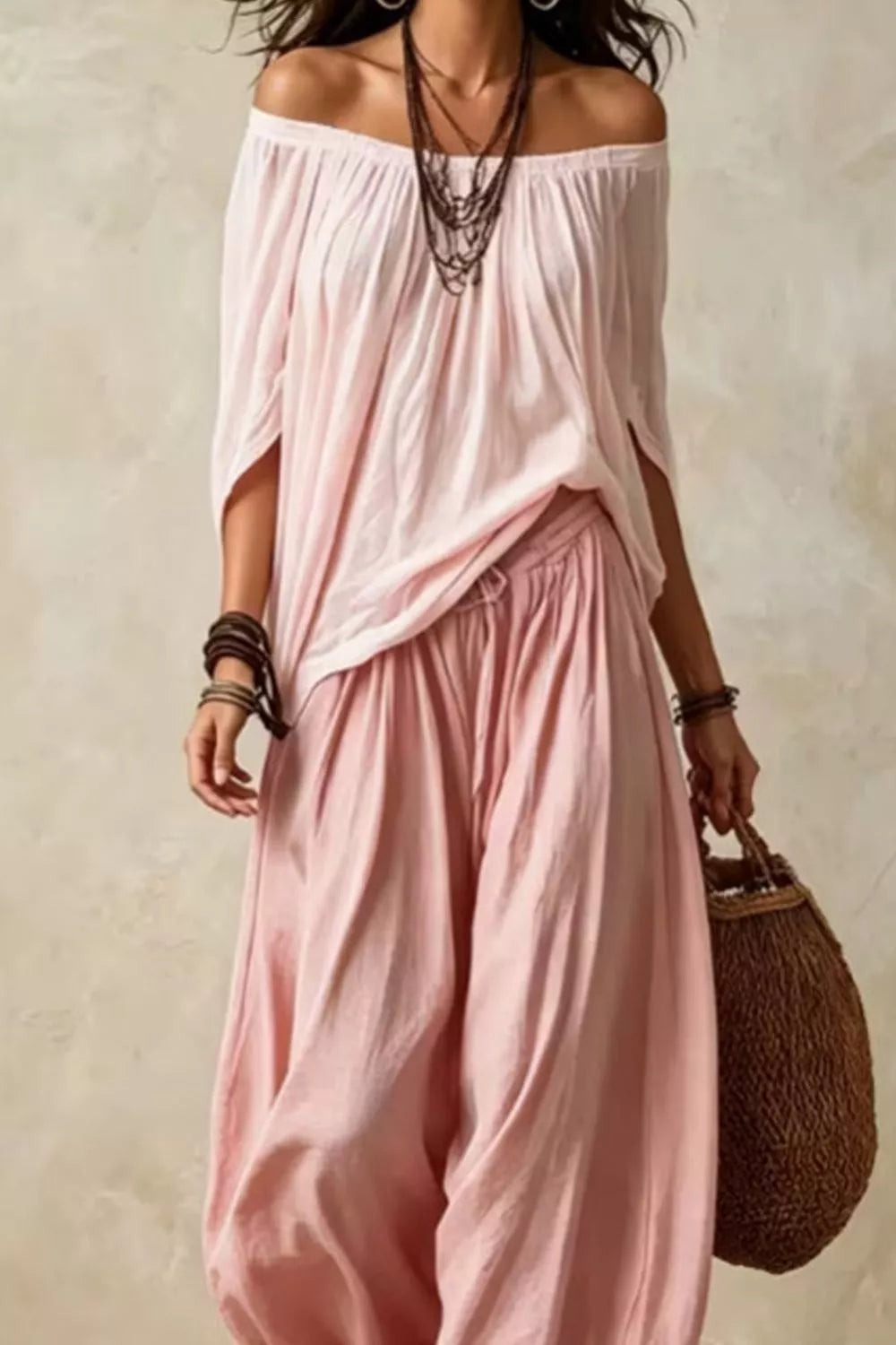Plus size off-shoulder top and wide-leg pants matching set by Trendsi, featuring a stylish, comfortable coordinated outfit.