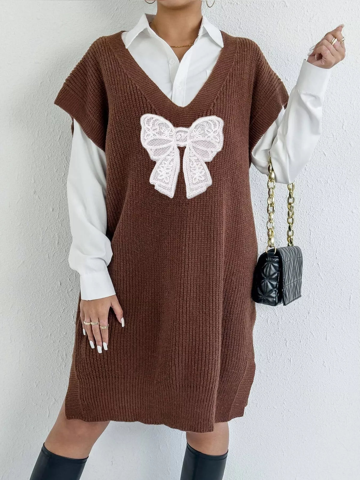 Embroidered bow V-neck sweater vest by Trendsi, featuring a cozy knit design with decorative bow embroidery at the front.