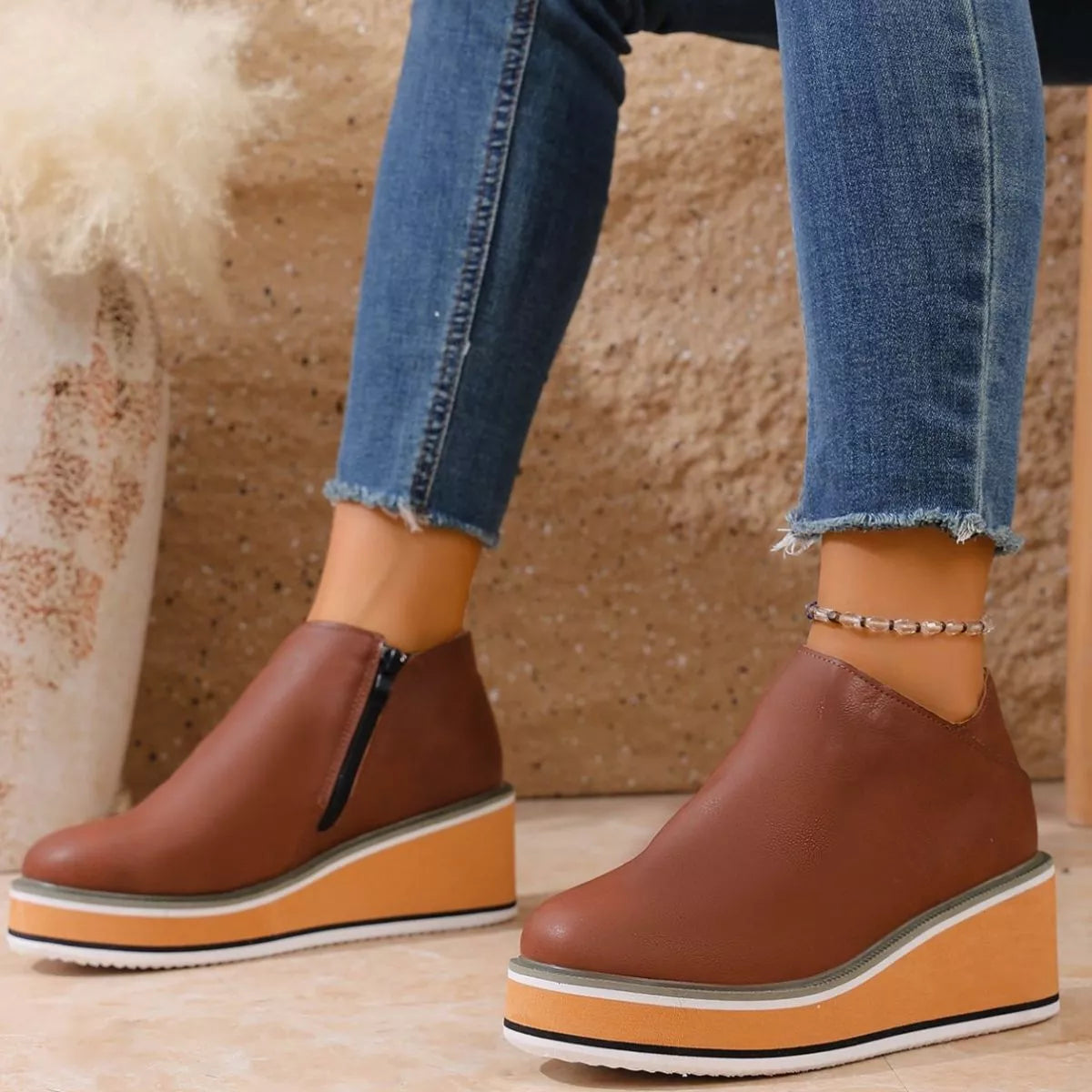 Women's round toe wedge ankle boots by Trendsi featuring a stylish design, perfect for casual and chic outfits.