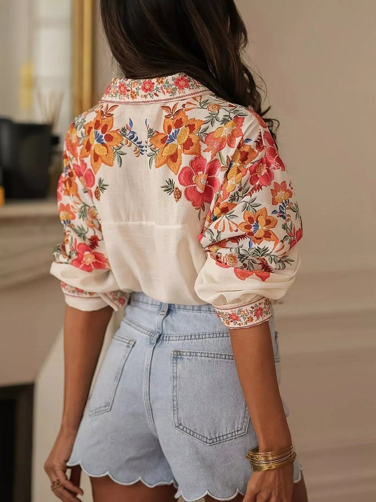 Floral print button-up shirt by Plush Fashion Hub, featuring vibrant floral patterns and a classic collar design.