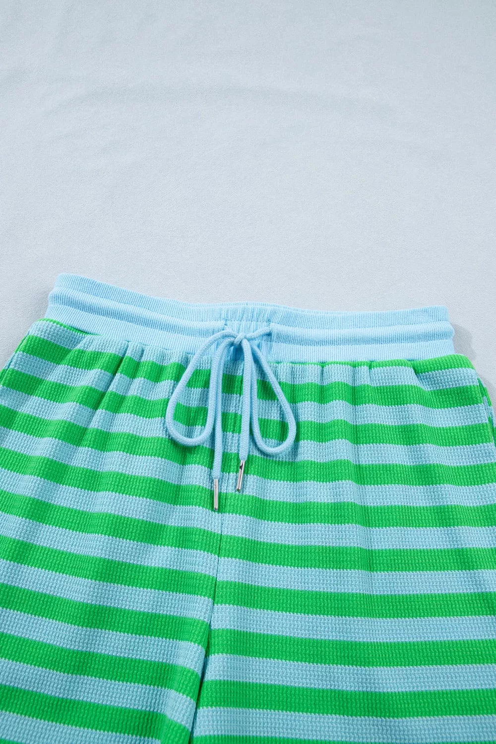 Stripe colorblock puff sleeve top and drawstring shorts matching set by Plush Fashion Hub, featuring vibrant stripes and casual style.