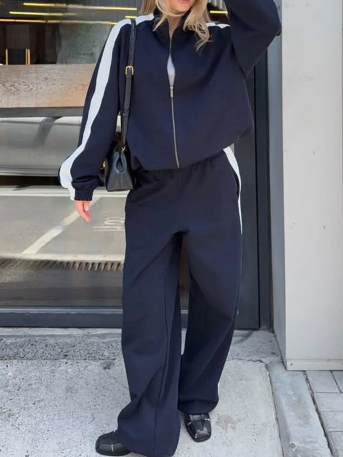 Plush Fashion Hub zip-up long sleeve tracksuit set with a comfortable fit and stylish design, shown in a cozy, casual outfit.