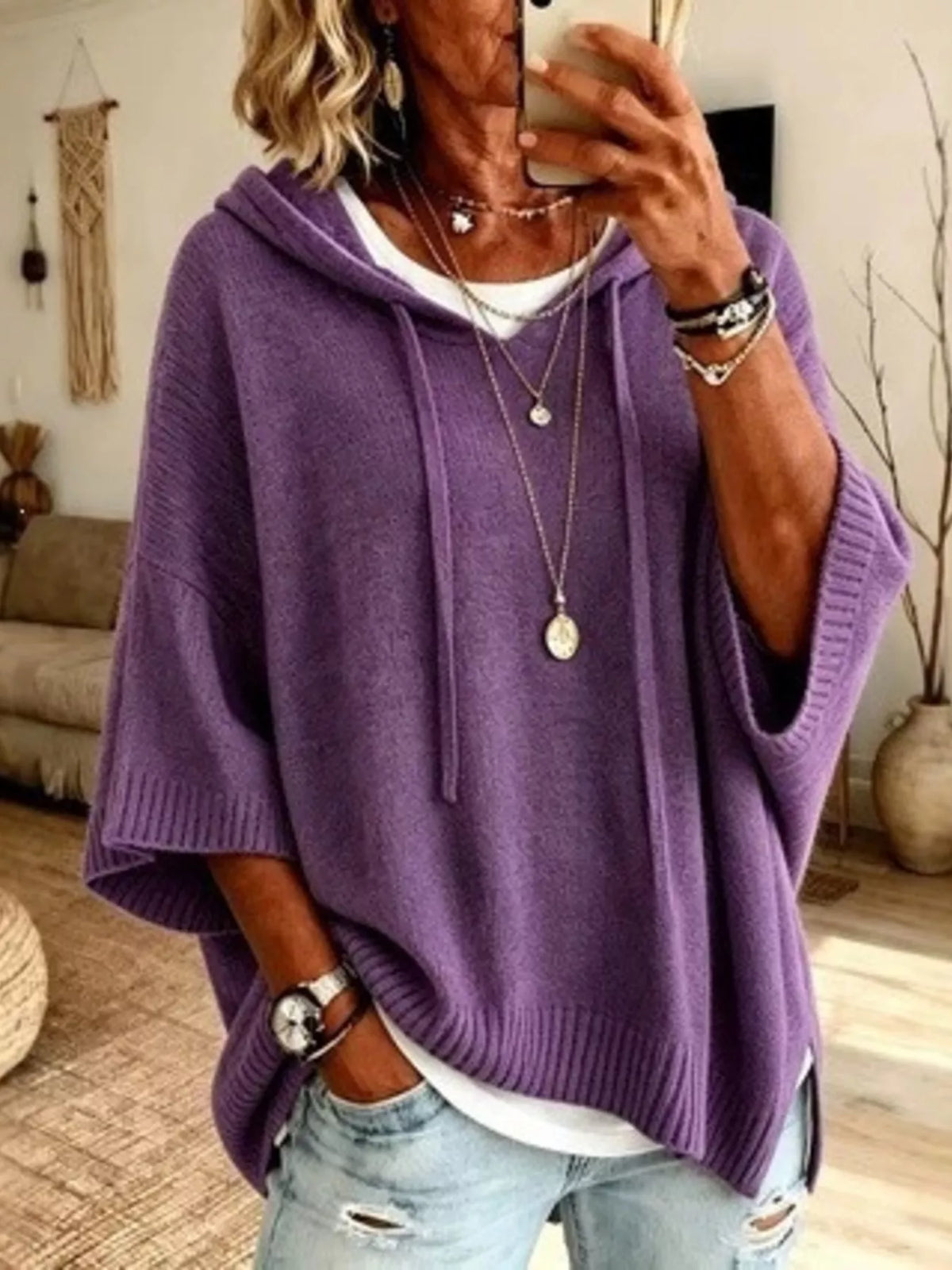 Plus size hooded sweater with drawstring and 3/4 sleeves from Trendsi, featuring a cozy, casual fit and soft fabric.