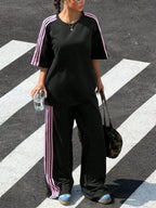 Trendsi striped short sleeve top and matching pants set, casual summer outfit with blue, white, and pink stripes, laid flat.