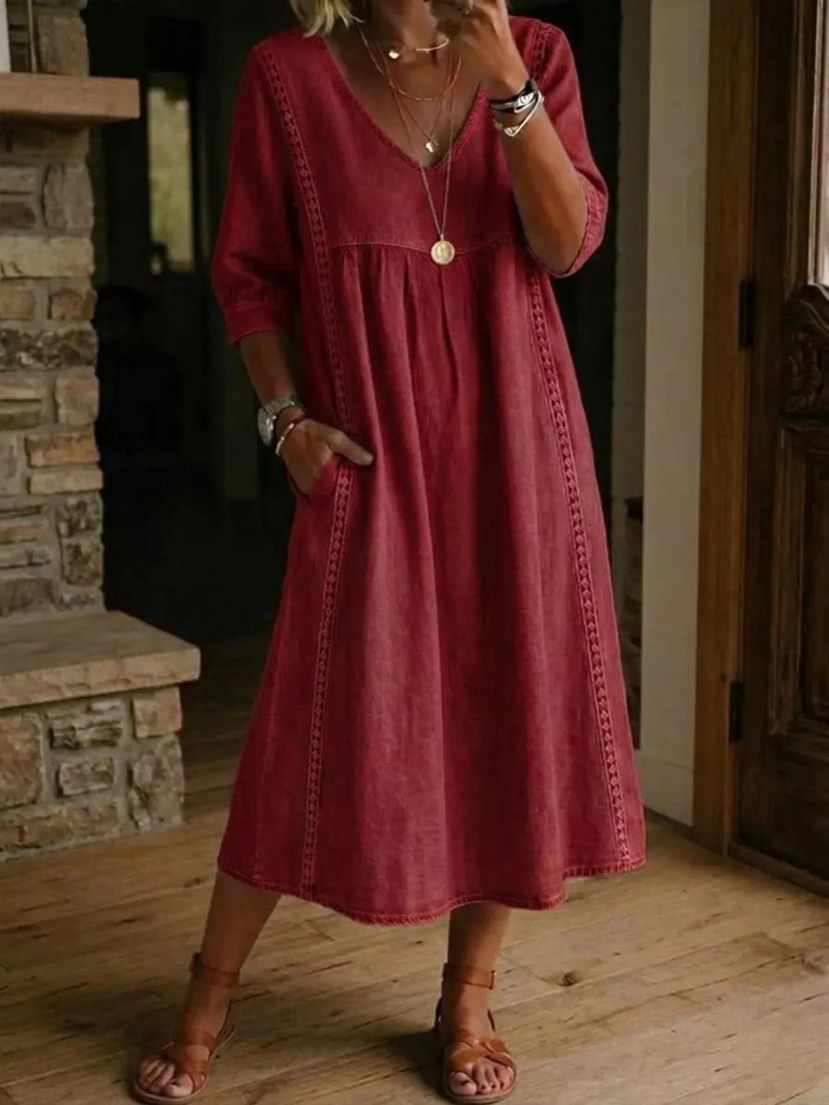 Plus size full-length V-neck midi dress with 3/4 sleeves by Trendsi, featuring a stylish and comfortable design.