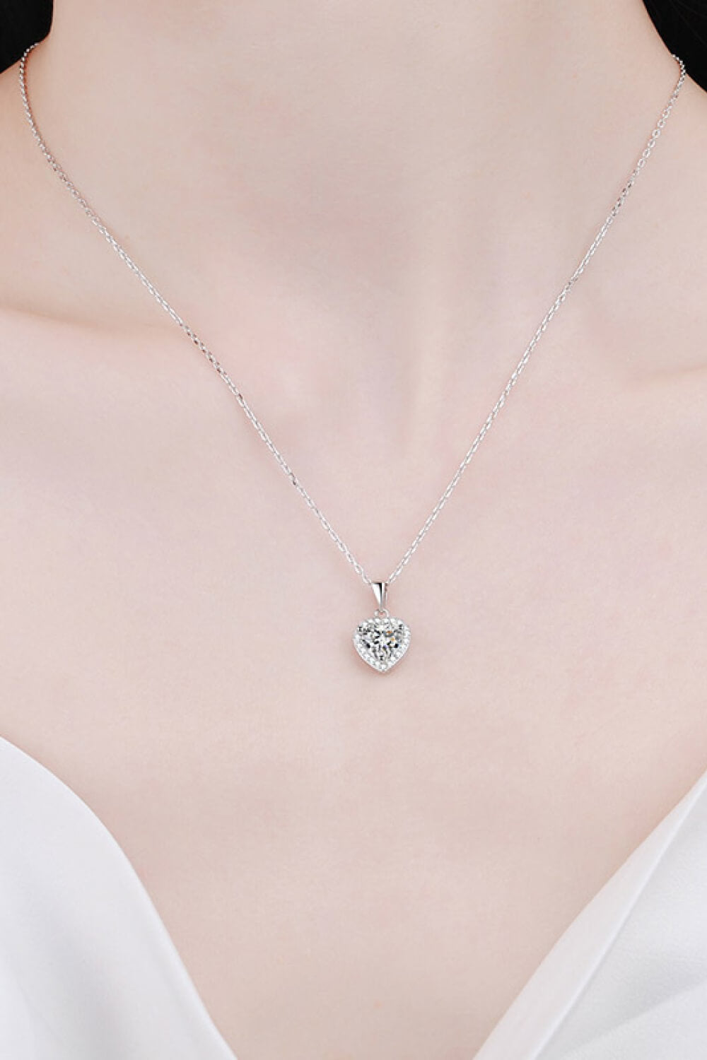 1 Carat Moissanite heart pendant necklace with chain, featuring a sparkling heart-shaped gemstone on a delicate chain.
