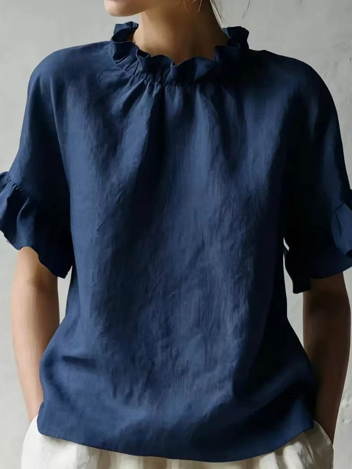 Plus size ruffled neck blouse with half sleeves from Plush Fashion Hub, showcasing a stylish full-size women's top.