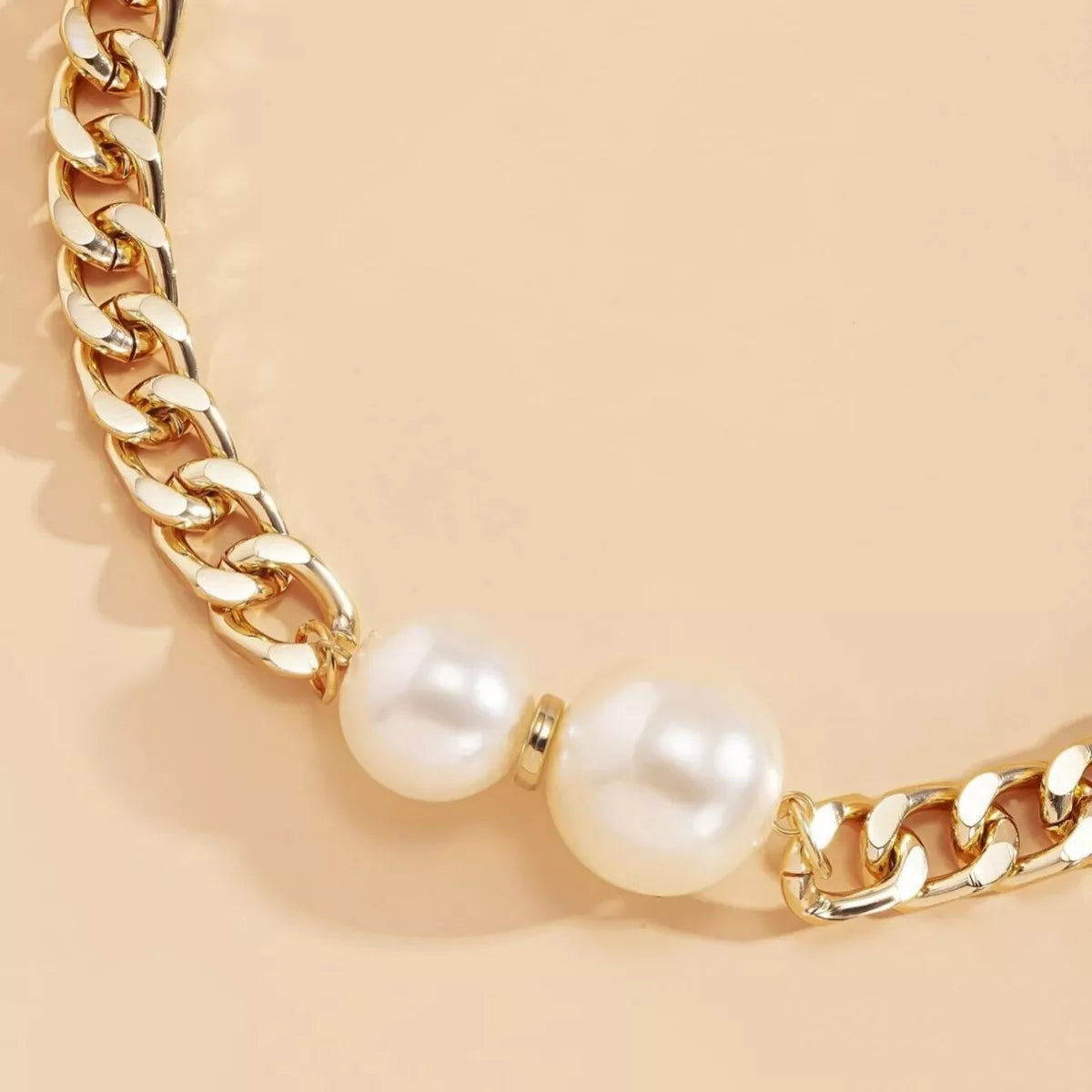 18K gold-plated pearl necklace featuring a string of lustrous pearls on a delicate chain, styled for elegant wear.