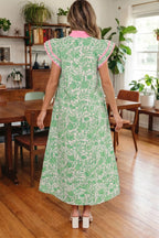 Floral midi dress with contrast trim and flutter sleeves from Trendsi, featuring a feminine floral pattern and elegant design.