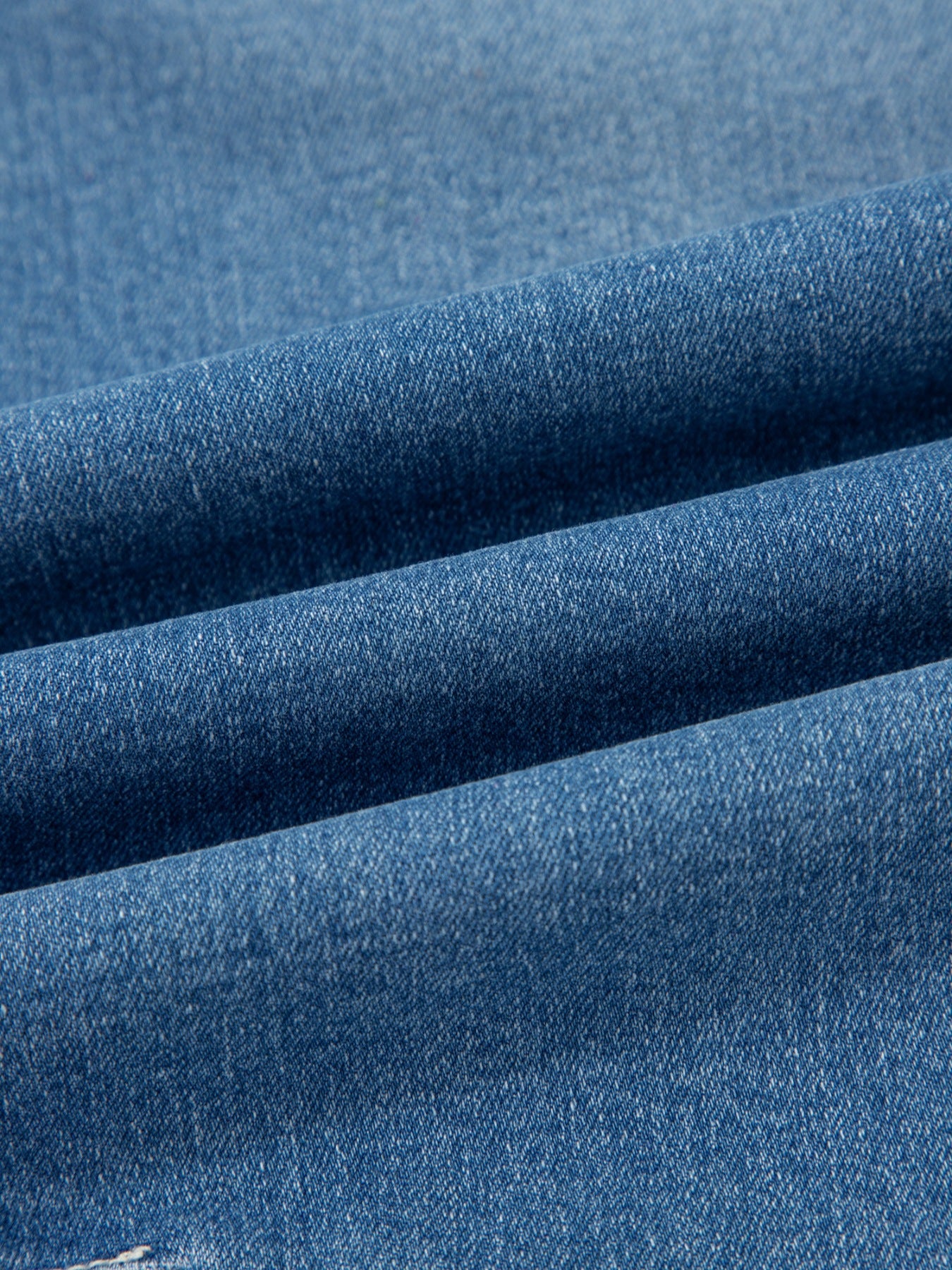 Washed cuffed barrel leg jeans by Trendsi, vintage relaxed fit denim bottoms with distressed details and rolled cuffs.