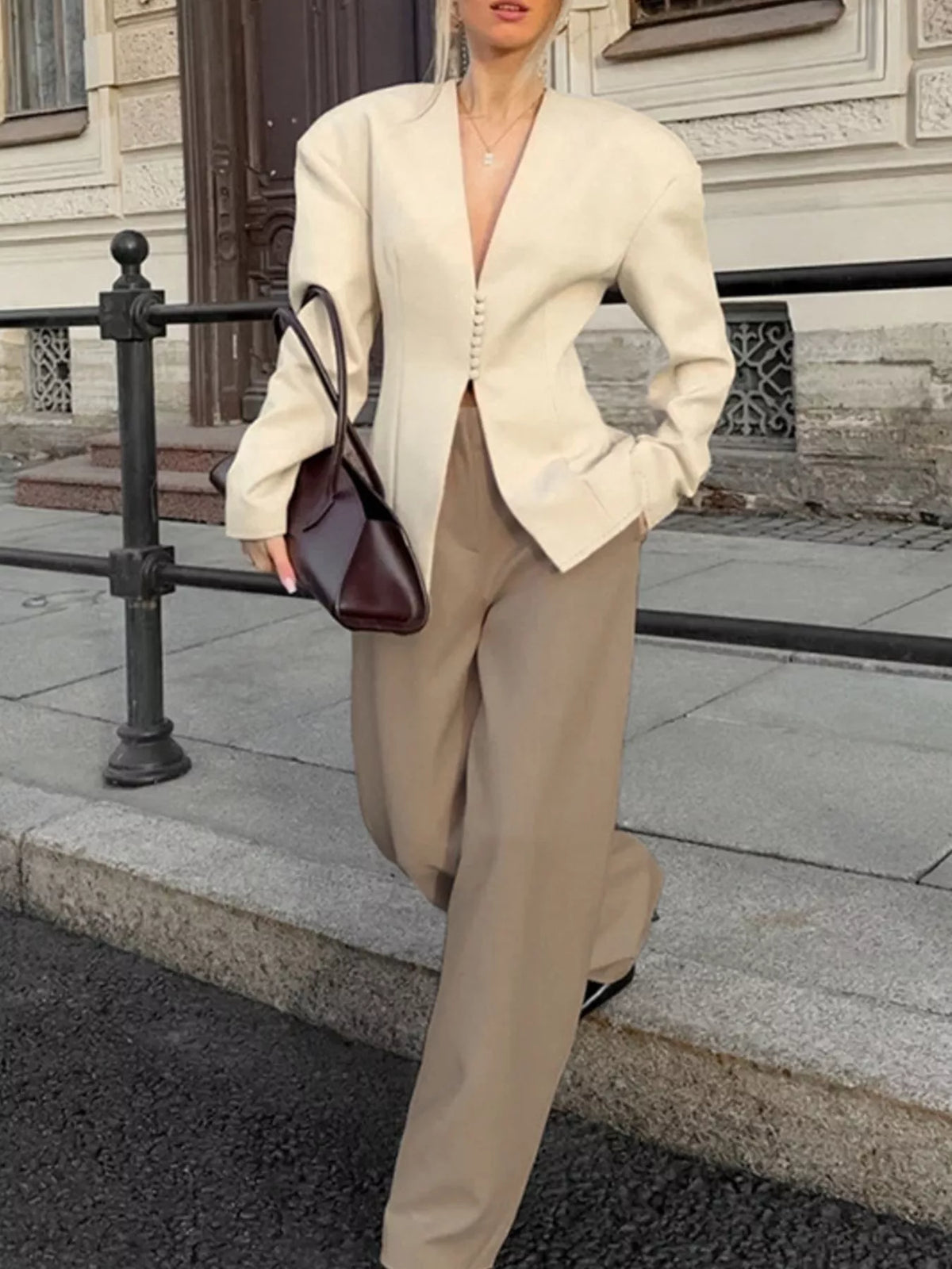 Trendsi women's V-neck button-up blazer with structured shoulders, tailored fit, and classic style for a polished professional look.