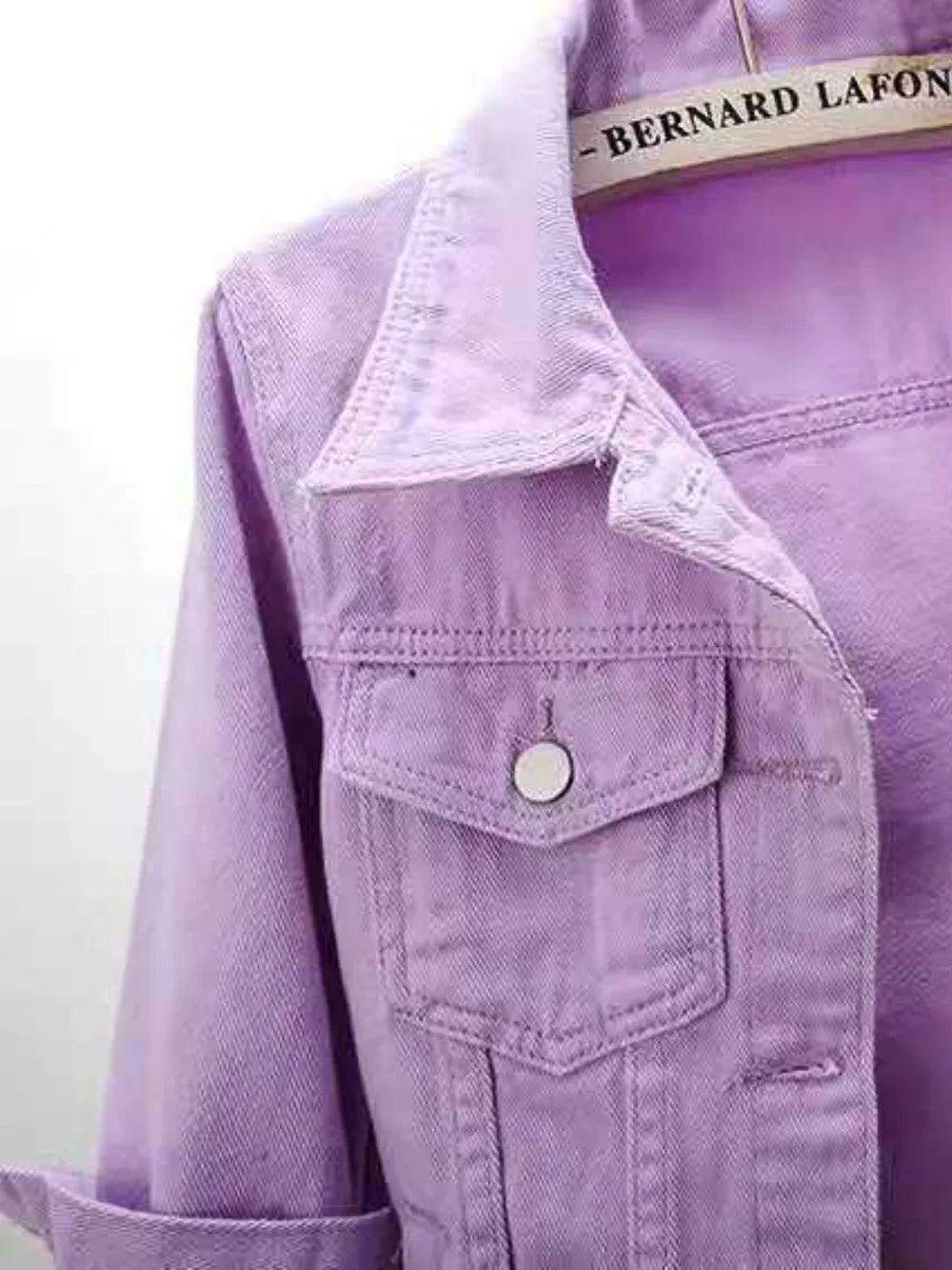 Plus size full length cropped denim jacket from Trendsi, showcasing classic blue denim with front pockets and button closure.