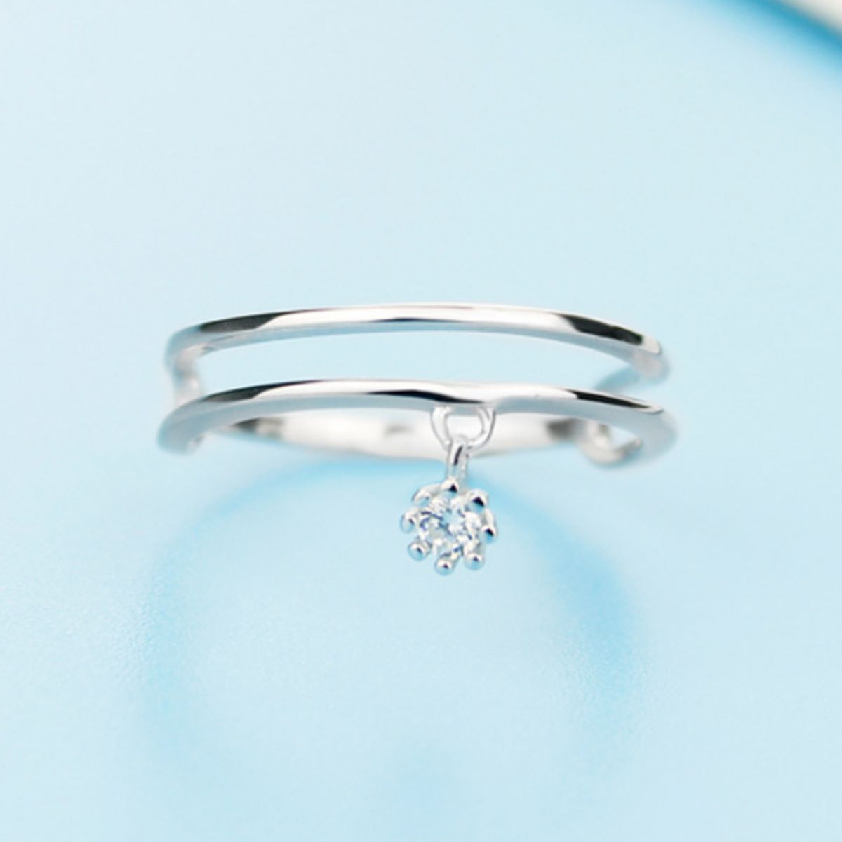 Sterling silver ring with double layered design, crafted by Plush Fashion Hub, showcasing intricate band details and polished finish.