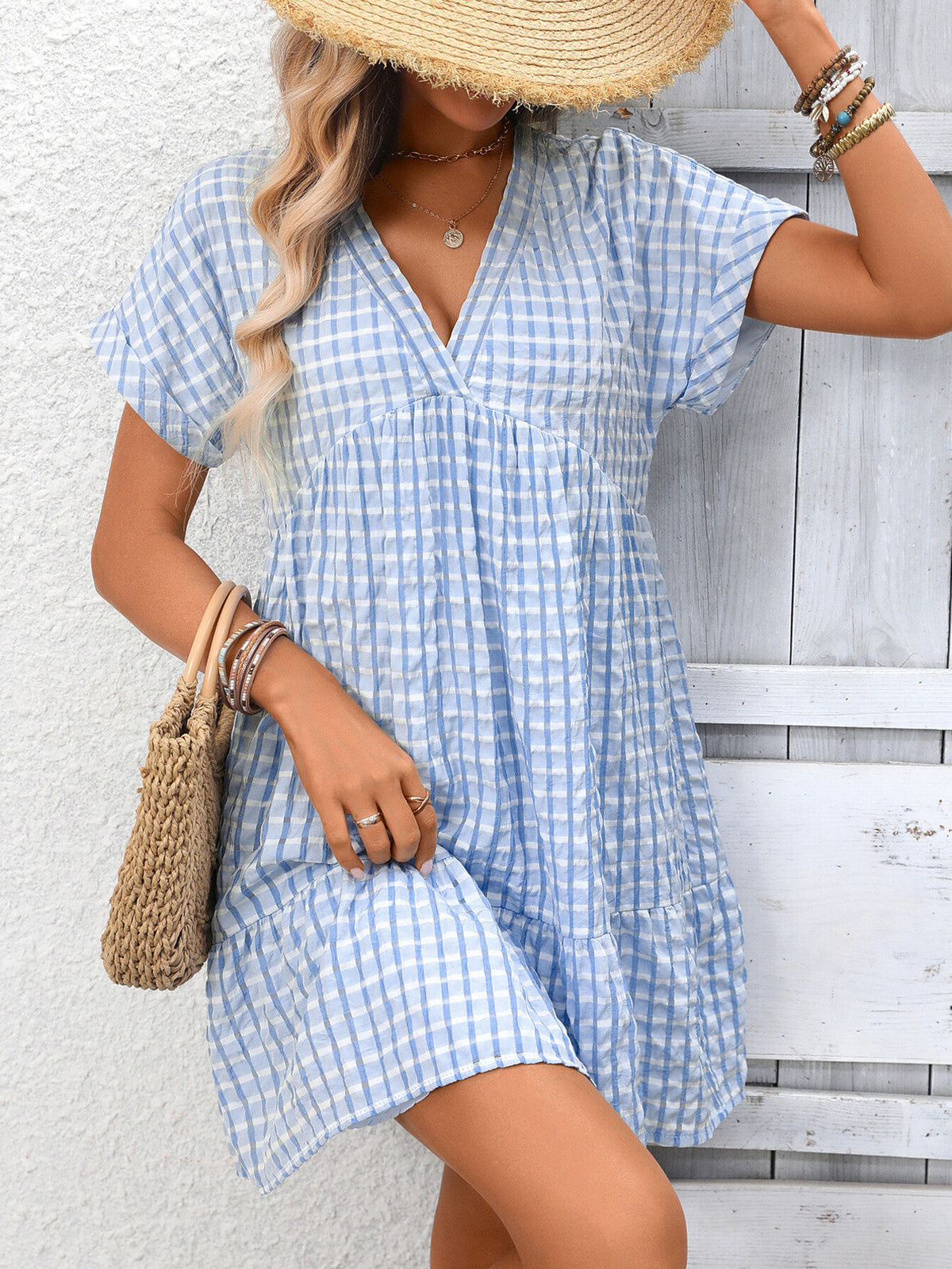 Plush Fashion Hub plaid v-neck mini dress with ruffle hem, stylish and feminine for casual or semi-formal occasions.