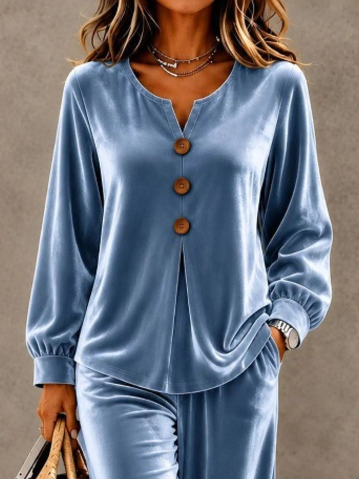 Elegant velvet button top and matching pants set by Trendsi, featuring a stylish and comfortable design with a smooth velvet texture.