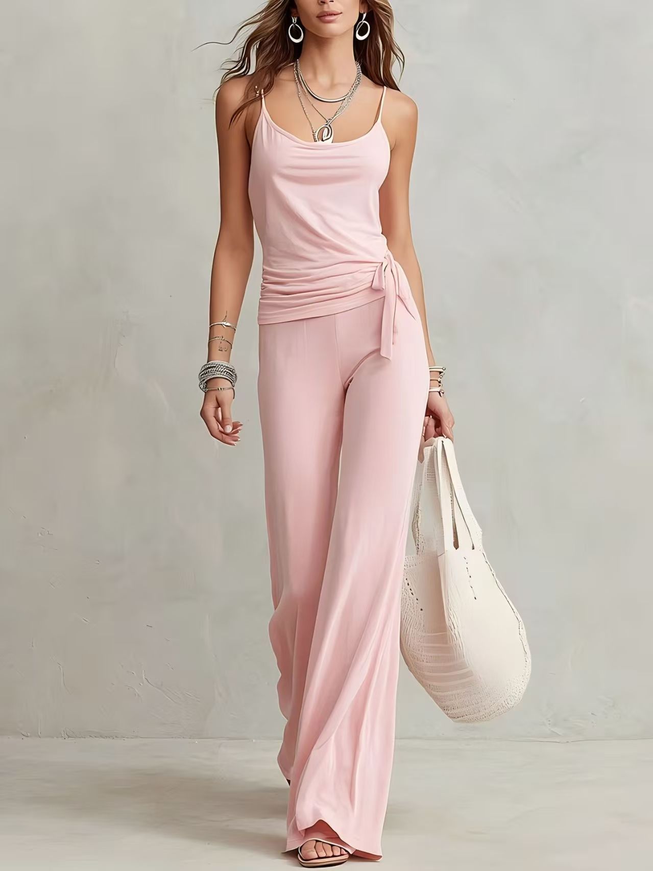FitiqueFit women's sleeveless solid color casual two-piece set with top and pants, perfect for relaxed everyday wear.