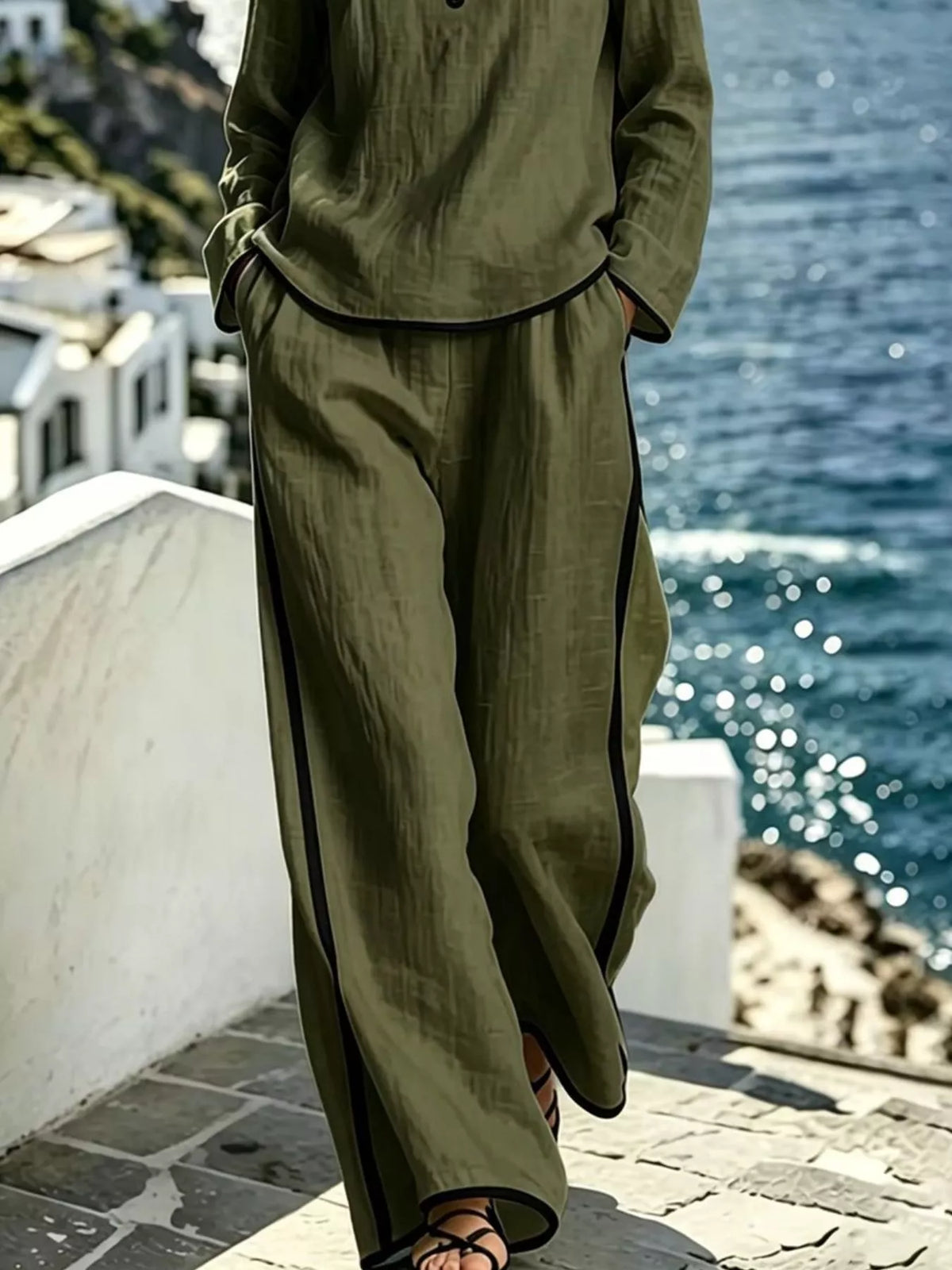 Contrast trim long sleeve top and pants set by Trendsi, featuring a stylish coordinated outfit with black and white details.