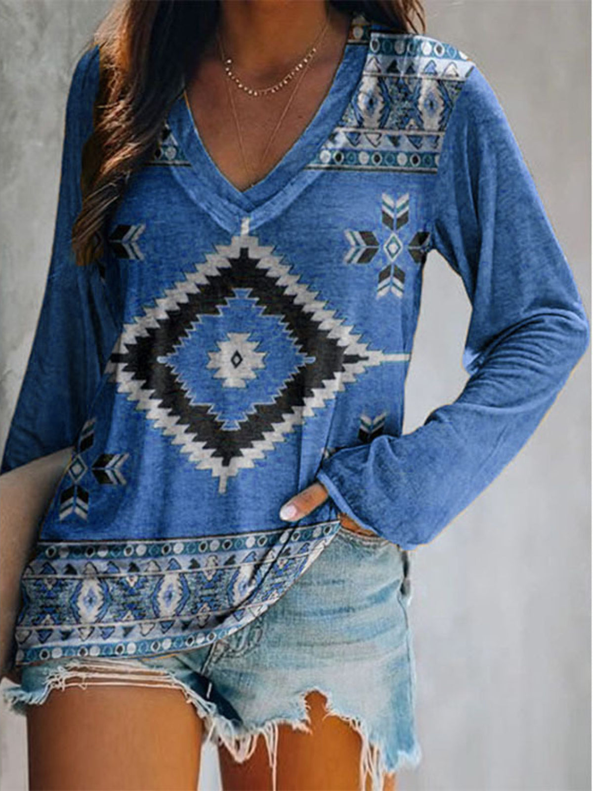 Plus size geometric print V-neck long sleeve T-shirt by Plush Fashion Hub, casual top with stylish modern design.