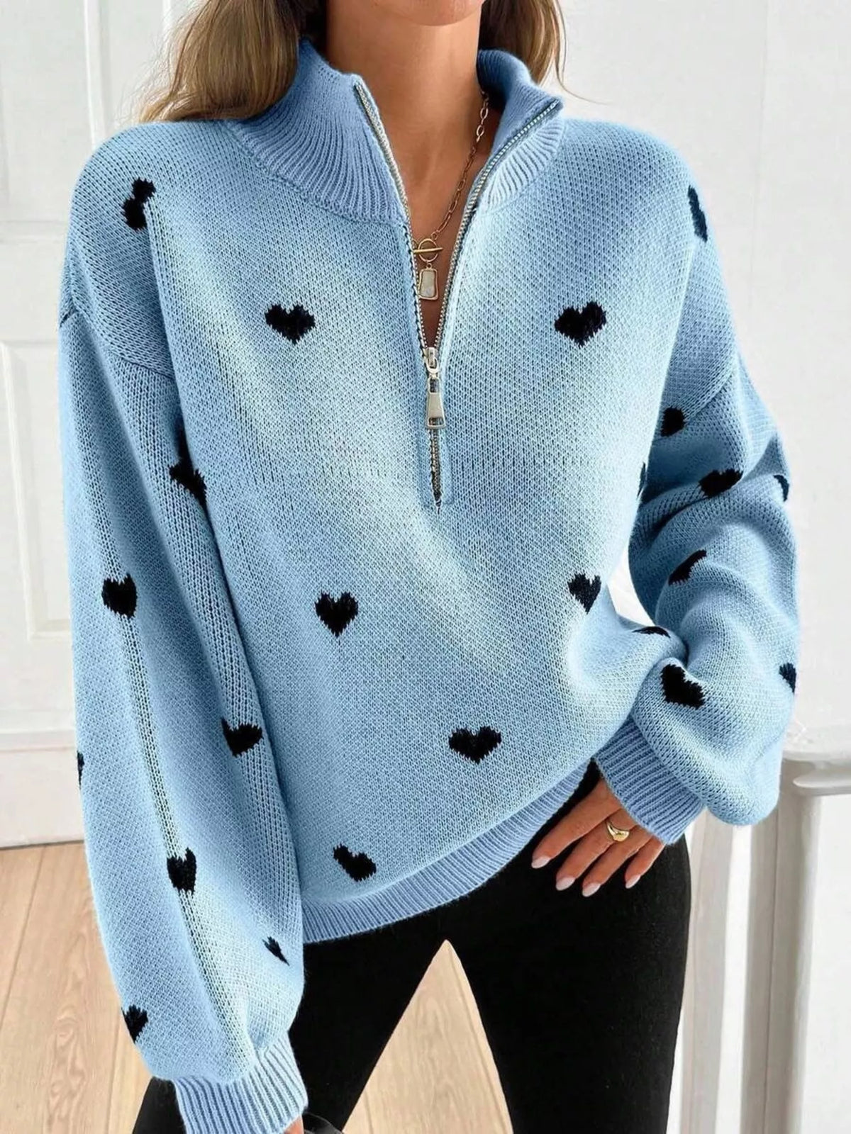 Plus size full heart half-zip long sleeve sweater by Trendsi, showing soft knit fabric and cozy fit in a flattering design