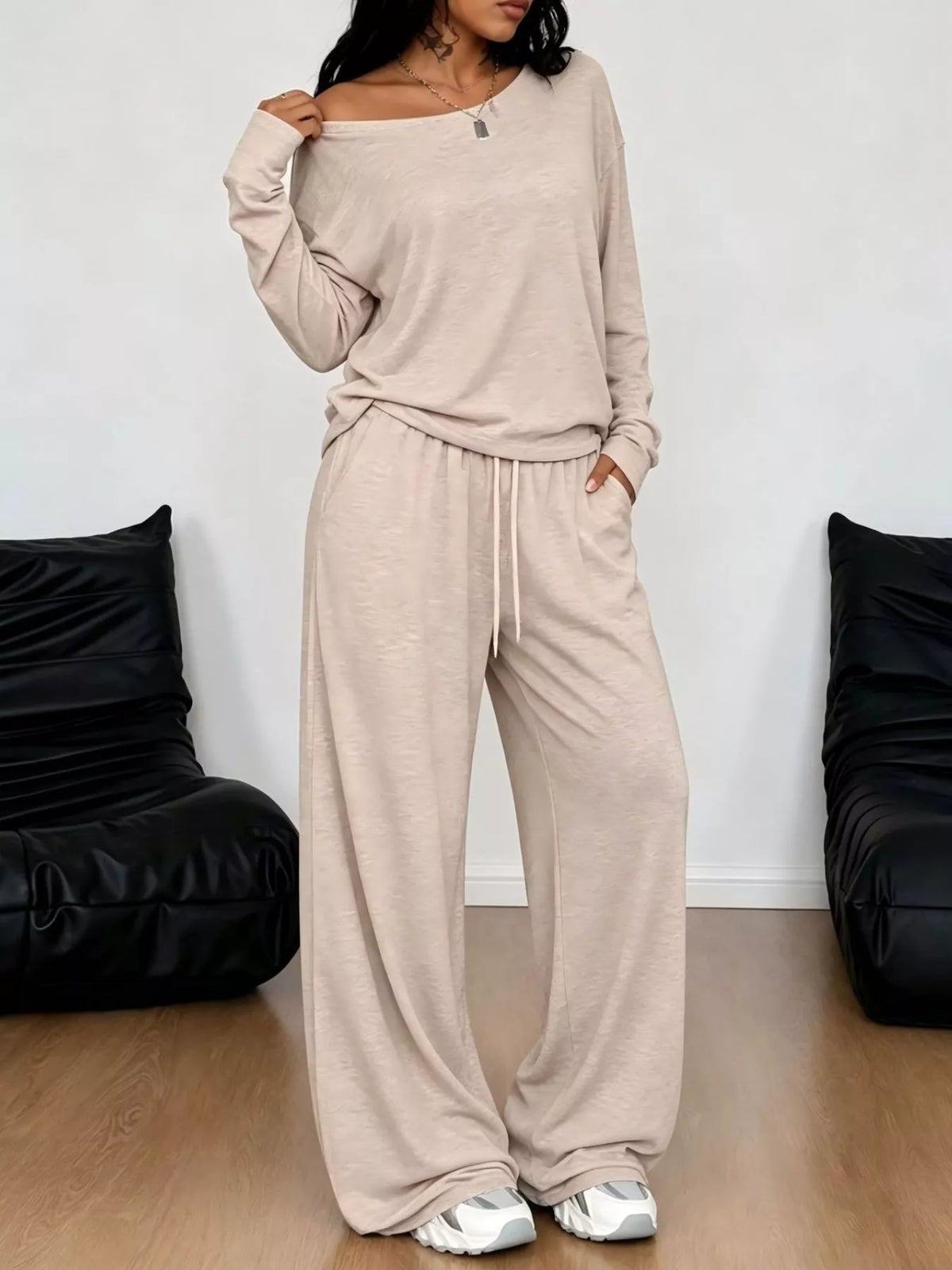 Plus size loose fit one-shoulder T-shirt and pants set by Trendsi, casual matching outfit with relaxed fit and stylish design.