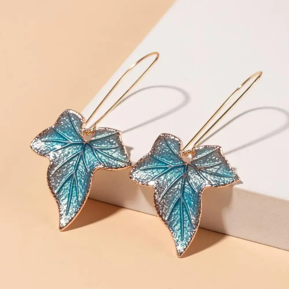 Plush Fashion Hub alloy leaf drop earrings with delicate leaf-shaped design hanging from hooks, stylish jewelry accessory.