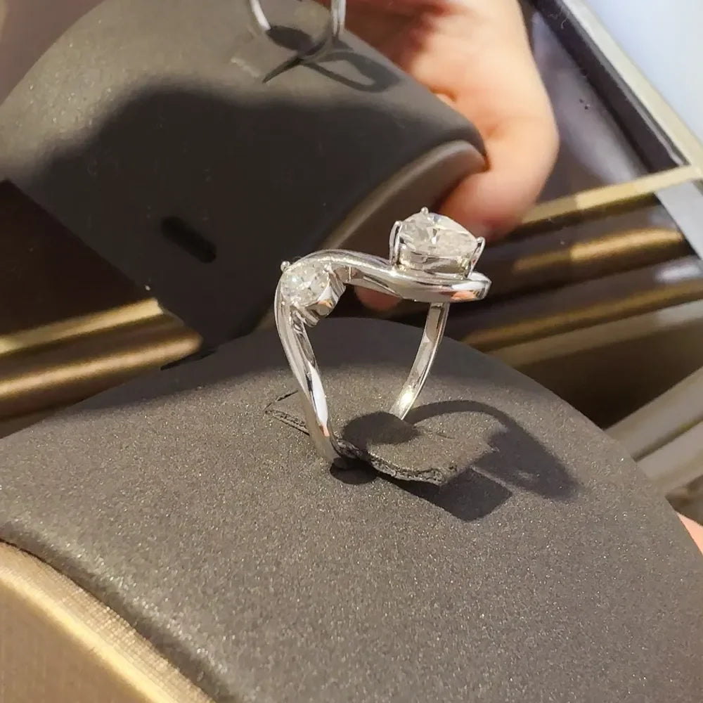 Irregular shape 1.3 carat moissanite ring in sterling silver, showcasing a unique design and sparkling gemstone.
