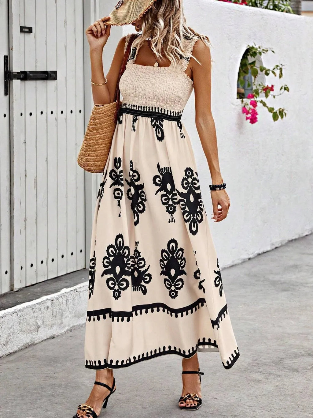 Plush Fashion Hub smocked printed wide strap maxi dress featuring a flowy silhouette and vibrant floral patterns.